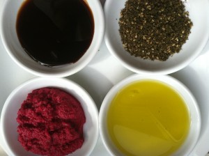 Clockwise from top left: Date syrup, za'atar, olive oil, sumac